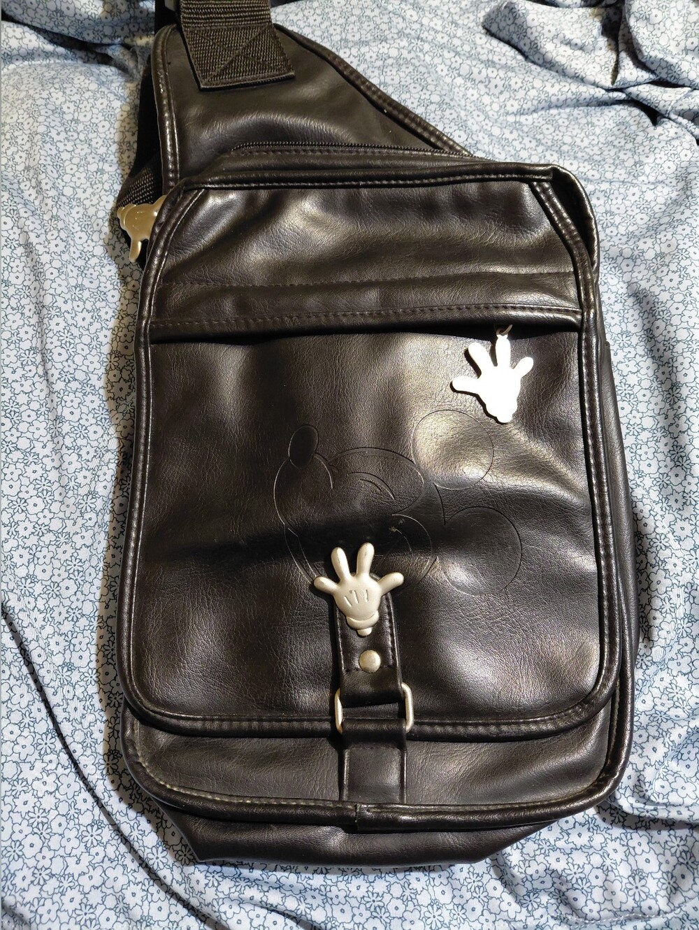 black faux-leather Disney Mickey Mouse sling backpack